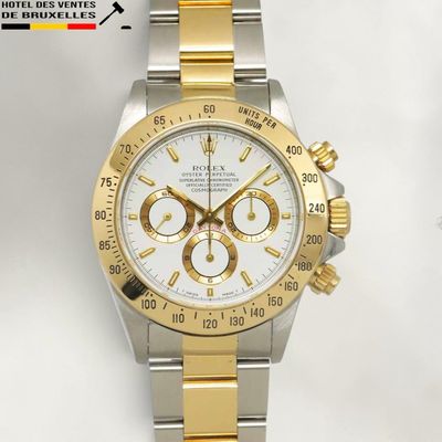 a gold and silver watch with a white face