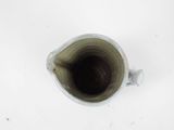 a cup that is sitting on a white table