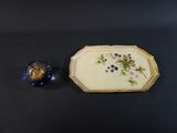an image of a picture of a blue and white plate and a blue vase