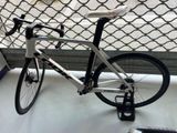 a bike that is sitting on a table in front of a fence
