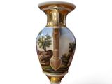 an image of a vase with a landscape painted on it