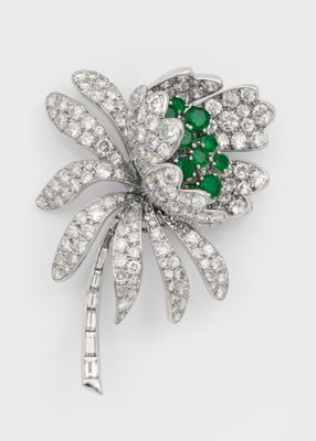 an emerald and diamond broochle, by cartier