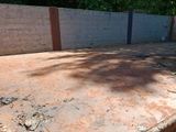 a concrete wall and a concrete floor in a yard