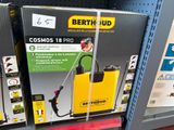 a box with a spray gun on it in a store