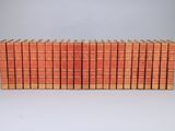 a stack of books sitting on top of each other on a table