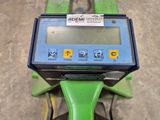 a green motorcycle with a digital display on the back