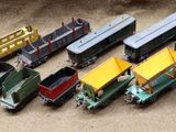 a lot of toy trains that are sitting on a table
