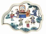 a plate with a picture of a group of people on it