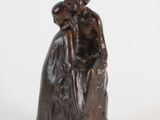 a statue of a woman holding a child on her lap