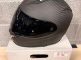 a helmet sitting on top of a box on a table