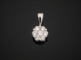 a diamond cluster pendant on a black background