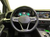 the interior of a car with a steering wheel and dashboard controls