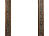 an old wooden frame with carvings and a white background
