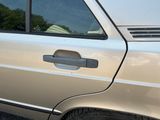 a car that has a door handle on the side of it