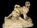 marble statue of a dog and a cat on a black background