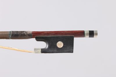 a bow that is attached to a string with a wooden handle