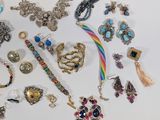 many different types of jewelry on a table
