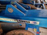 a close up of a blue machine with a sign on it