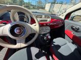 dashboard of a small car with a steering wheel and dashboard lights