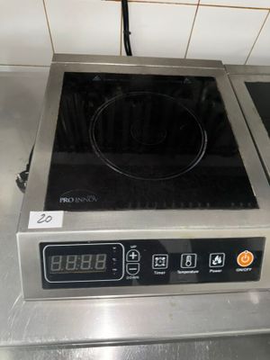 stainless steel counter top with a digital burner on top of it