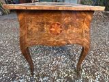 an image of a wooden table with a star design on top of it
