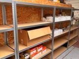 a shelf with boxes and boxes on it in a room