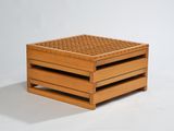 two wooden crates stacked on top of each other on a white surface