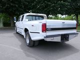 a white truck that is parked in a parking lot
