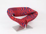a red chair with a blue and red design on it