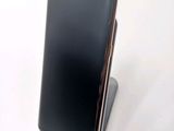 a cell phone that is sitting on top of a stand