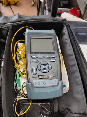 a woman sitting in a suitcase with a calculator in it
