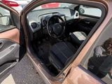 a man taking a picture of himself in a car