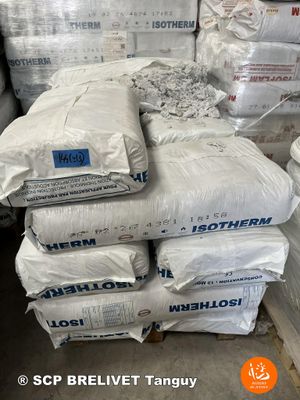 several bags of cement stacked on top of each other in a warehouse