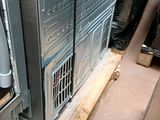 an air conditioner that is in the corner of a room