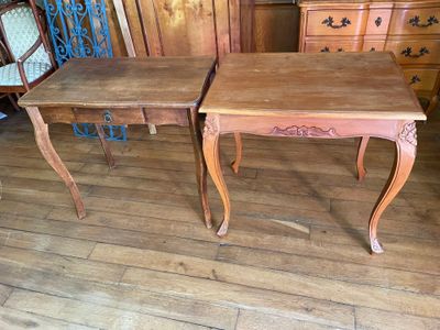 two tables that are sitting next to each other on the floor