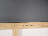a blackboard with writing on it in a room