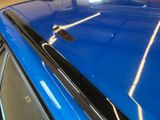 a blue car with a remote control on top of it
