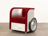 an image of a red and white chair with wheels