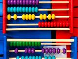an image of a colorful abacuse with many colored balls