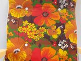 a chair that has a colorful floral print on it