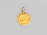 une pièce d'or sur laquelle est représenté le visage d'une femme