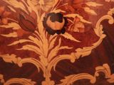 a wooden table with a floral design on it