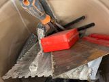 a bucket full of tools that are sitting in the bucket