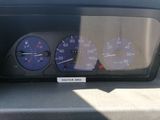 a close up of a car dashboard with a speedometer and other gauges