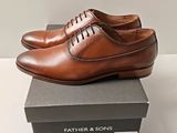 men ' s tan leather dress shoes with laces on top of a box
