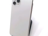 the back of an iphone 11 with a camera attached to the back of it