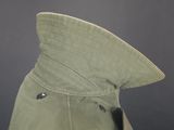 an image of a military hat with a metal buckle