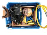 a blue box with a bunch of tools inside of it