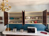 a small kitchen with a microwave and cabinets in it
