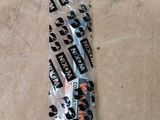 a tie that is wrapped in plastic on the floor